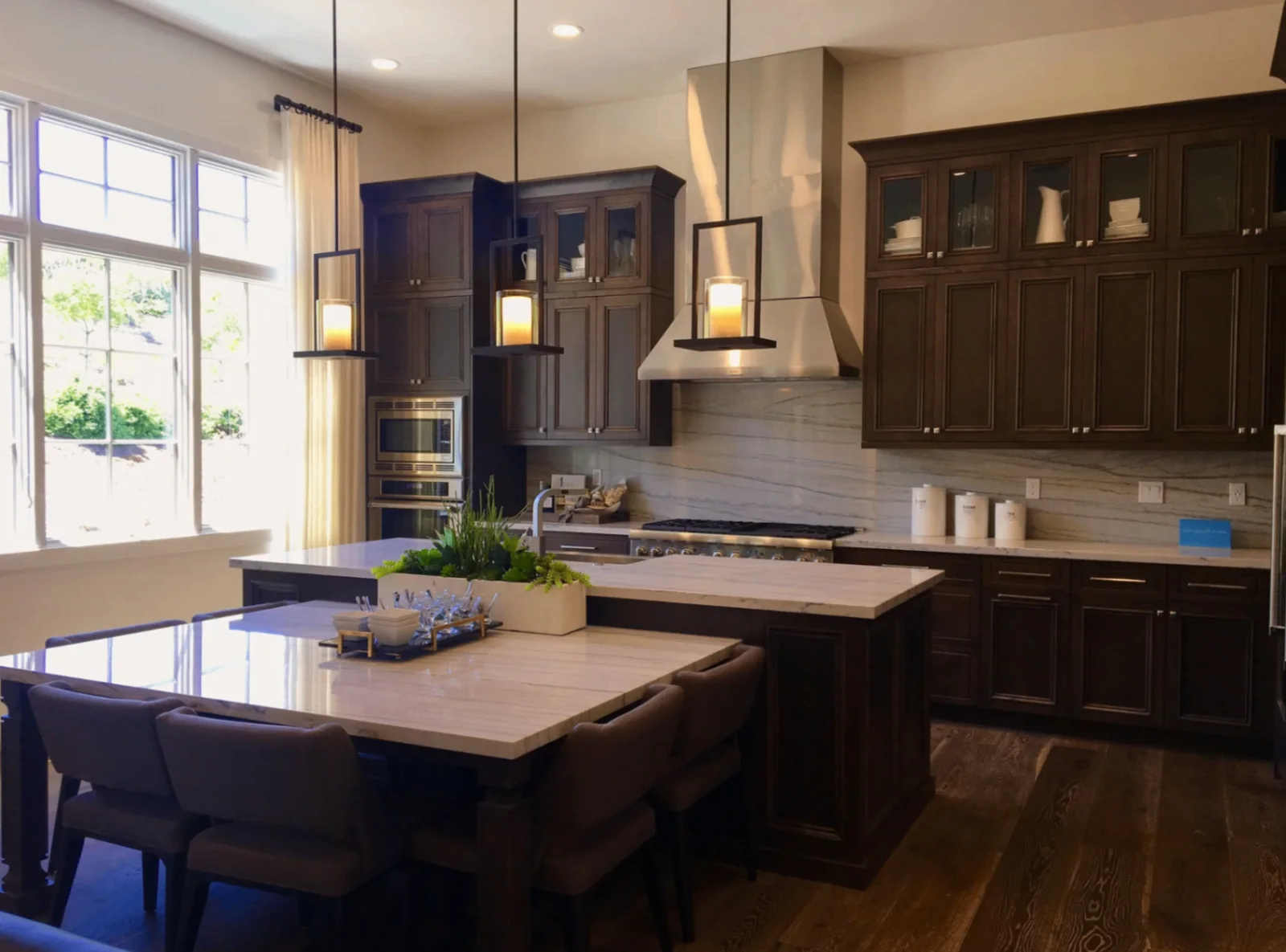 Quartzite kitchen island and counters with full-height backsplash