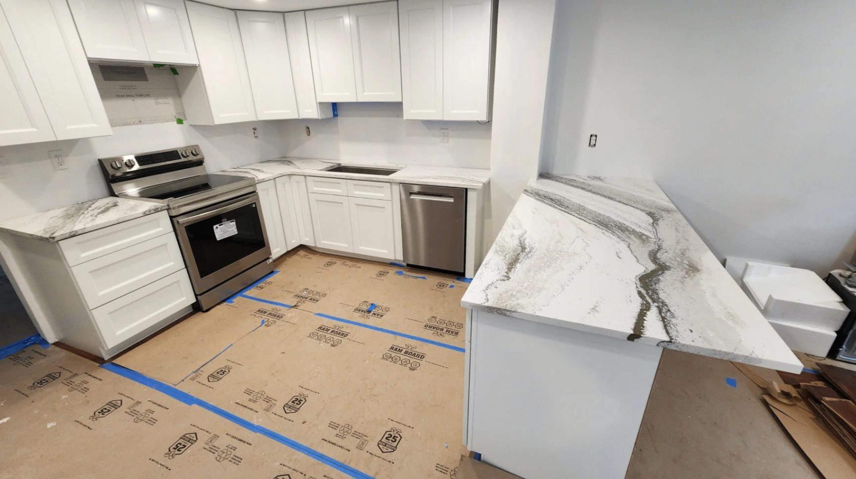 High-contrast veined quartz island and countertop