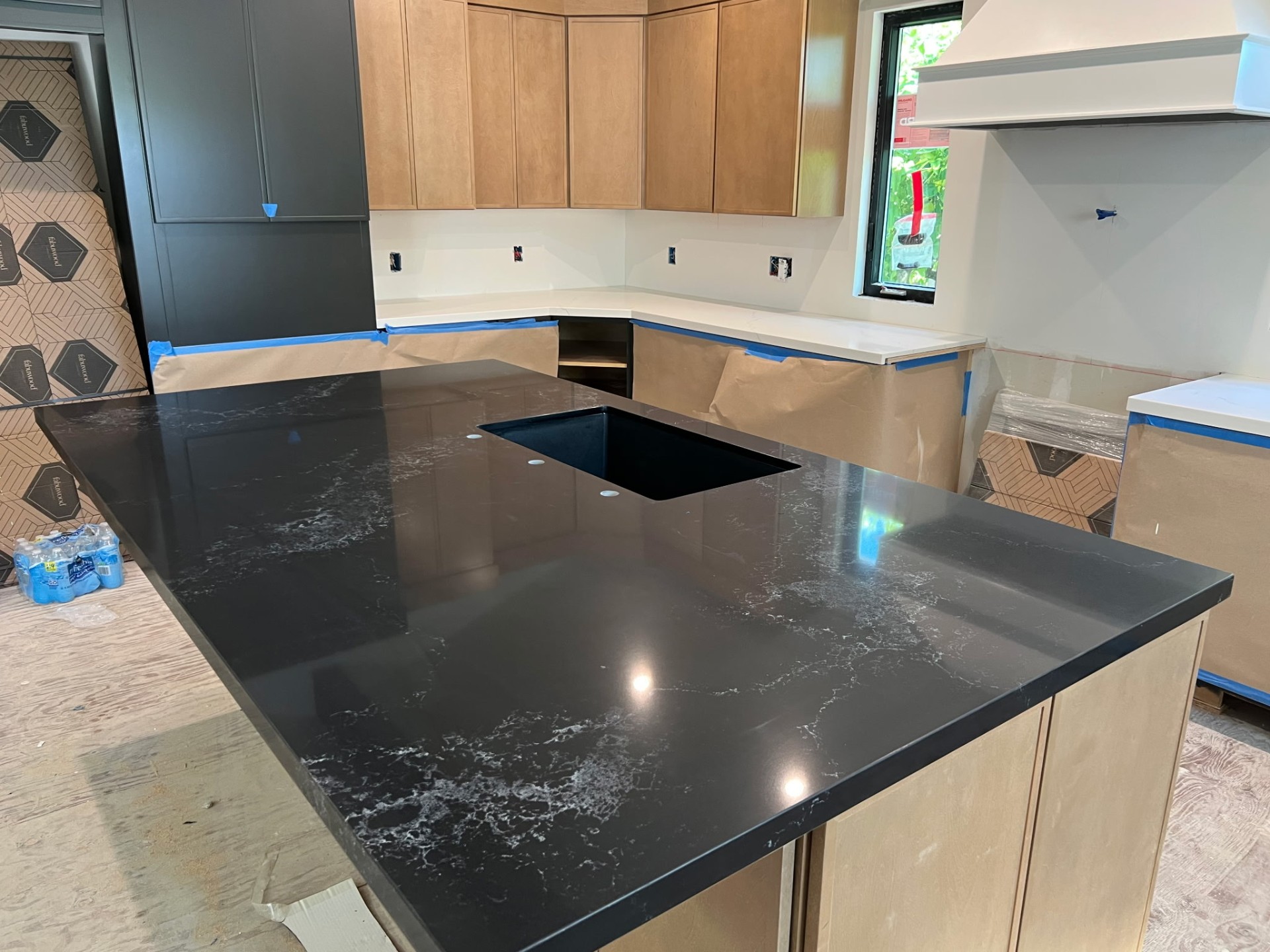 Black quartz island with marbled veining