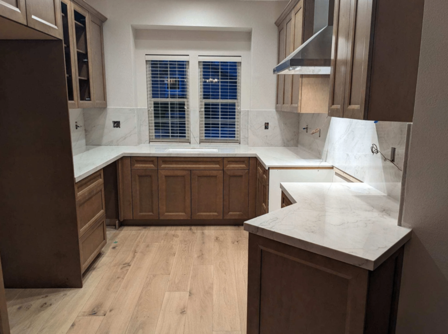 Warm-toned quartz countertops with clean edge detailing